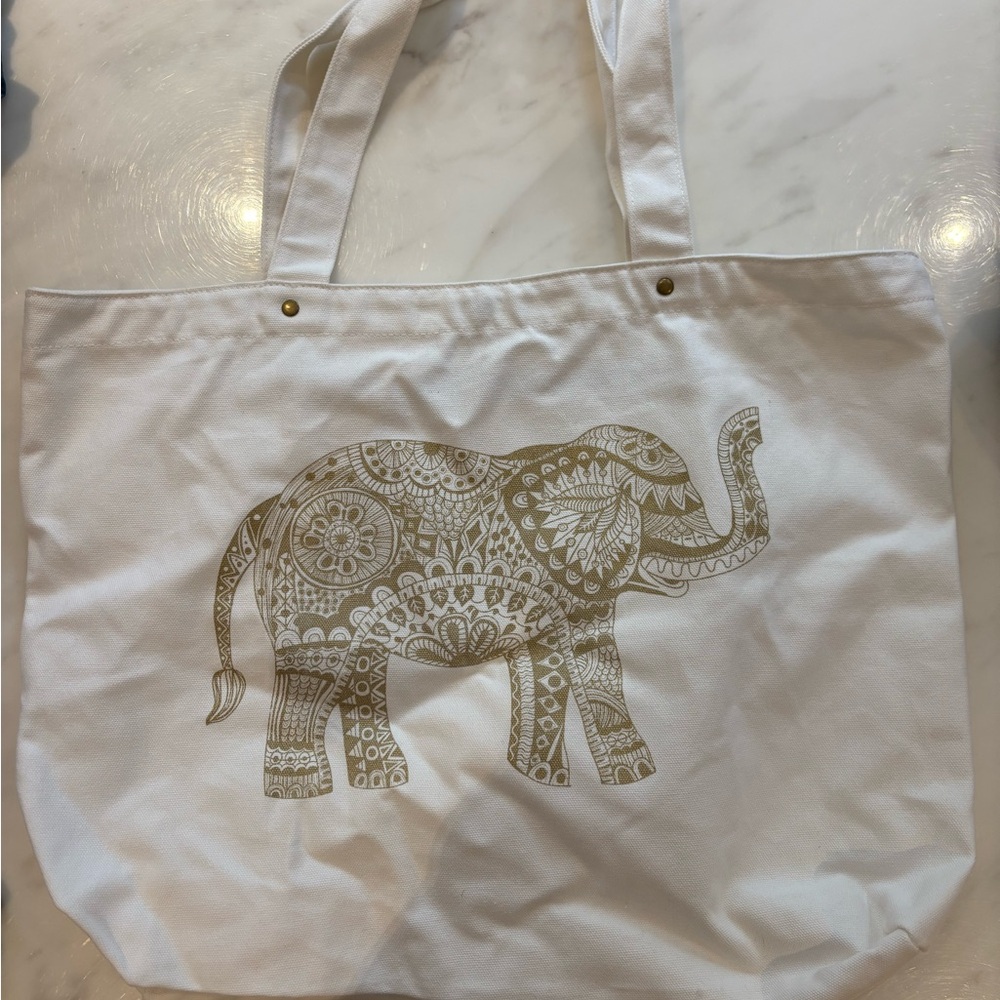 White Tote Bag with Gold Text by The Dialogue Projects